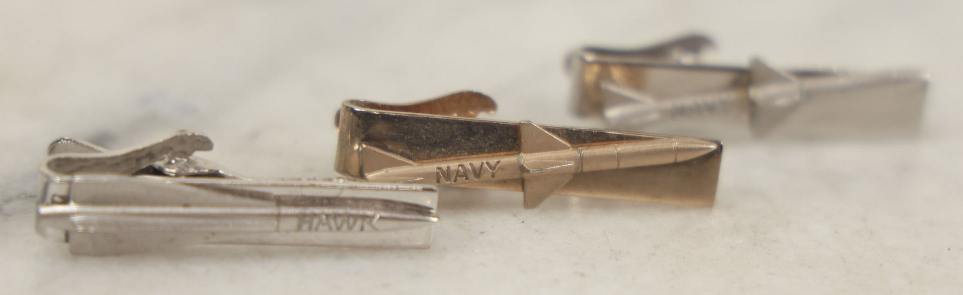 Lot 120 - Grouping Of Three Vintage Occupational Tie Bars With Missile Motifs, Two Marked Navy And One Marked Hawk