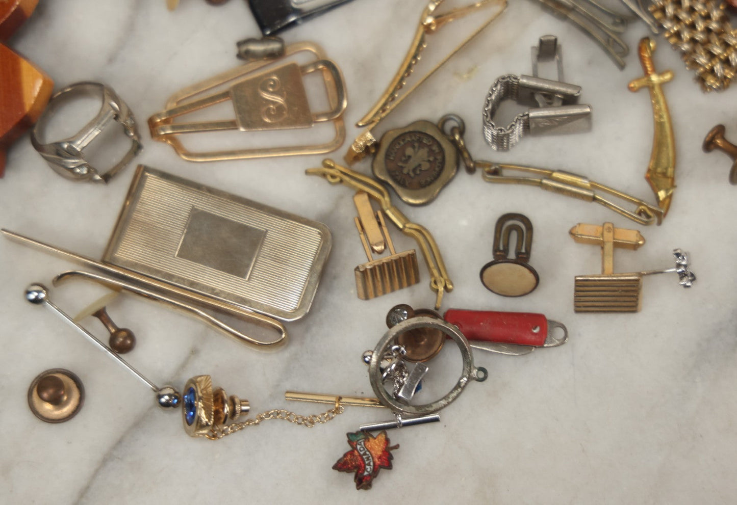 Lot 125 - Grouping Of 10+ Vintage Junk Drawer Items Including Jewelry, Pins, Tie Bars, And Wooden Bunny Chicago 1943 Pin