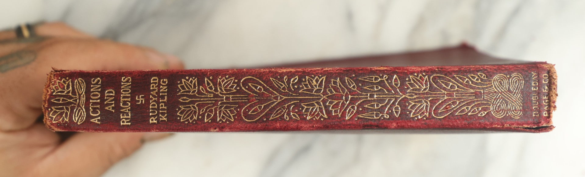 Lot 146 - "Actions And Reactions" Antique Ex-Library Book By Rudyard Kipling, Featuring Embossed Gilt Elephant Emblem With Whirling Logs Motif On Cover, Published By Doubleday, Page & Company, Garden City, New York, 1913