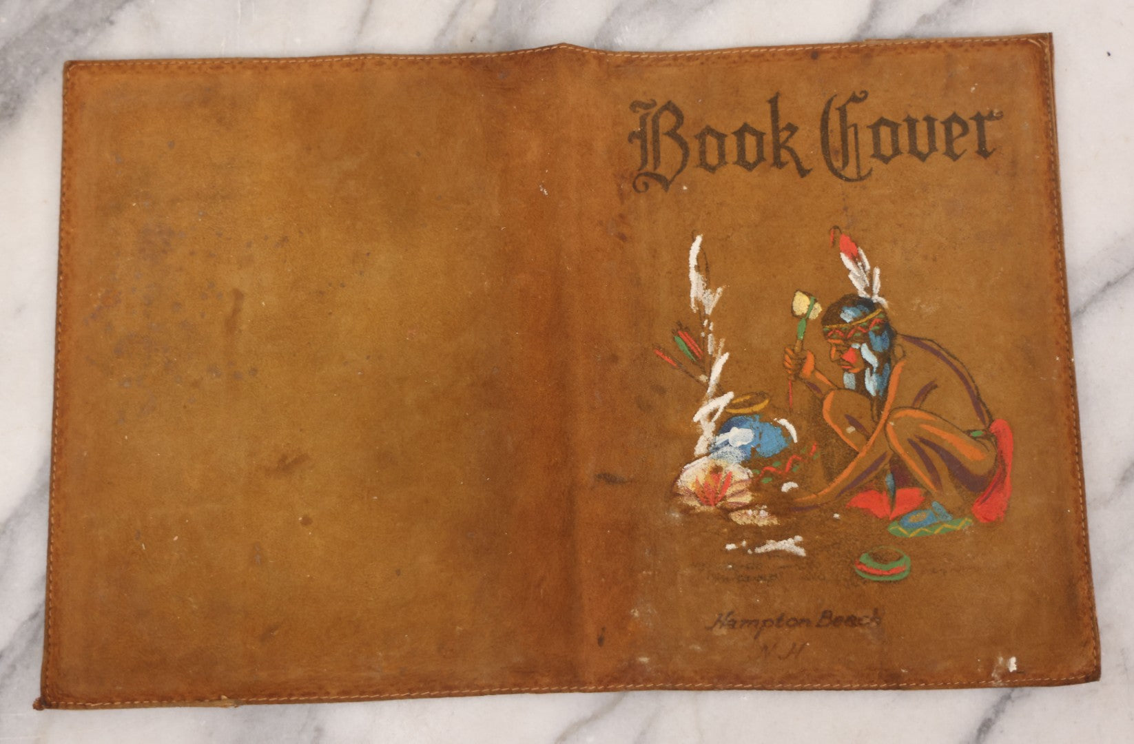 Lot 086 - Antique Hand-Painted Leather Souvenir Book Cover, Native American Man By Fire, Souvenir Of Hampton Beach, New Hampshire, Circa 1910