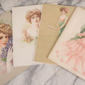 Lot 088 - Grouping Of Four Antique Color Lithographs Of Ladies In Period Fashion, 1900–1910, Illustrated By Maud Stumm, Published By The Gray Lith. Co., New York