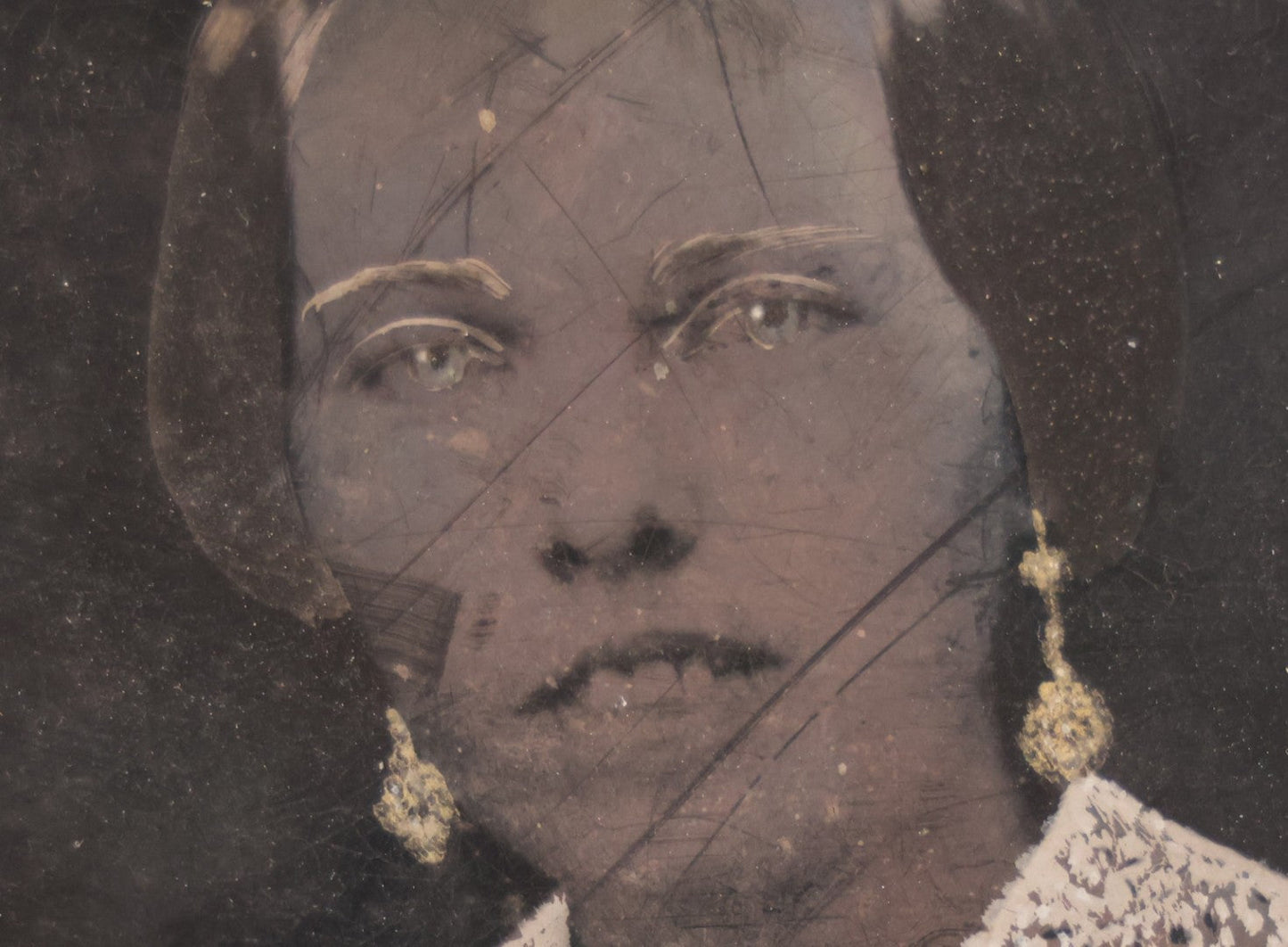 Lot 103 - Antique Tintype Photograph Of Woman With A Toothy, Stoic Expression, Hand-Painted Details, Slightly Smaller Than Half Plate
