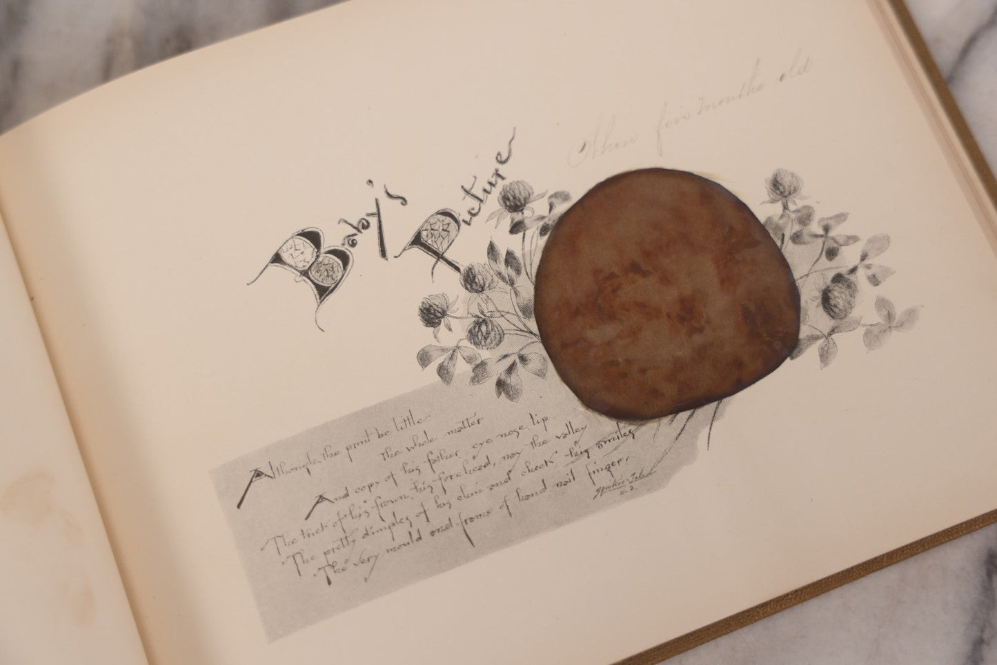 Lot 131 - "Baby's Kingdom" Antique Illustrated Baby Book With Gilt Embossed Clovers And Lettering On Cover, Gilt Foredge, Some Records Of Baby Harold Schenck, Born July 1892, With Calligraphy And Memos From Parents On 10+ Pages