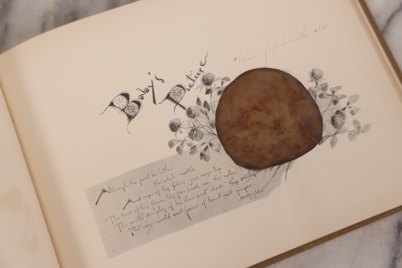 Lot 131 - "Baby's Kingdom" Antique Illustrated Baby Book With Gilt Embossed Clovers And Lettering On Cover, Gilt Foredge, Some Records Of Baby Harold Schenck, Born July 1892, With Calligraphy And Memos From Parents On 10+ Pages