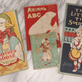 Lot 137 - Grouping Of Four Antique Linen Rag Books Including "Animal A.B.C." And "Toddle's A.B.C.," Published By Dean's Rag Book Co. Ltd., London, And "Ten Little Tin Soldiers"  And "Mother Goose," Published By The Saalfield Pub. Co., New York, 1910