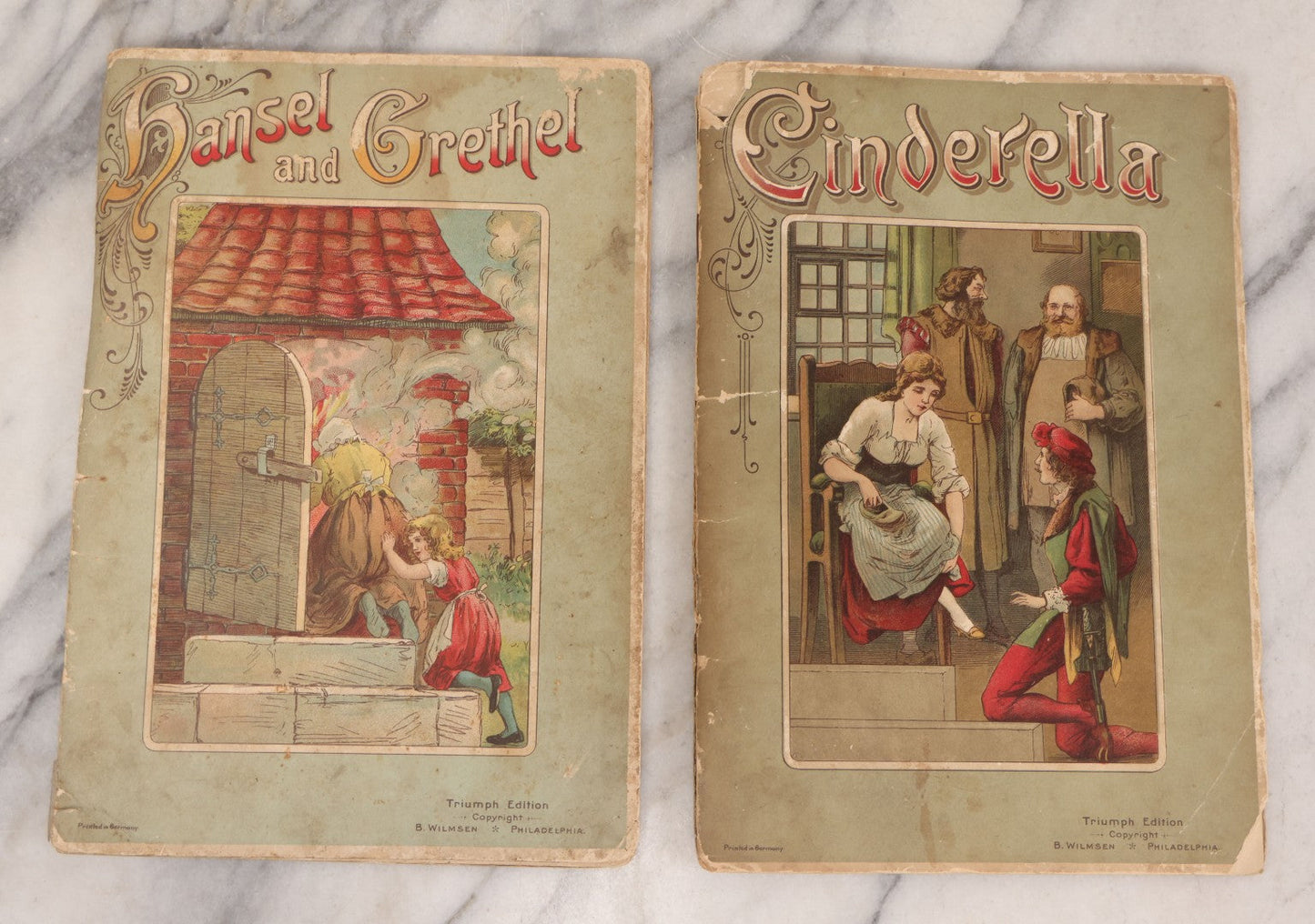 Lot 141 - Pair Of Antique German Pop-Up Fairytale Books Including "Hansel And Grethel" And "Cinderella," Triumph Editions, Published By B. Wilmsen, Philadelphia, Printed In Germany With Accordion Crepe Paper Pop-Ups, Circa 1895