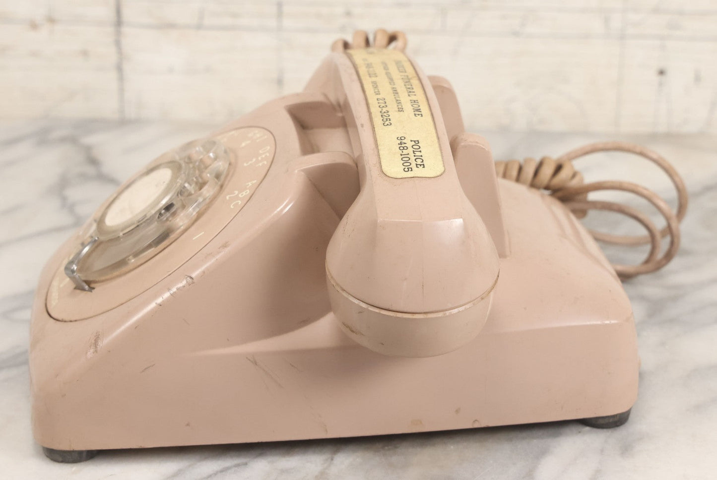 Lot 015 - Vintage Pink Rotary Telephone With Parker Funeral Home Label Advertising Oxygen Equipped Ambulances, Glow In The Dark Label With Numbers For Lodi, Spencer, Police And Fire, Untested