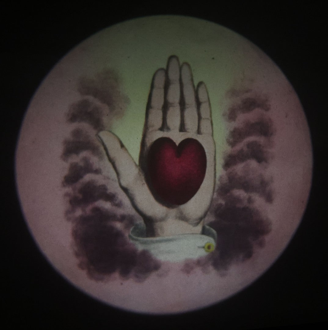 Lot 025 - Antique Hand Colored Odd Fellows I.O.O.F. Magic Lantern Glass Slide With Wood Holder, No. 9 Heart And Hand, Manufactured By The Henderson-Ames Co., Kalamazoo, Michigan
