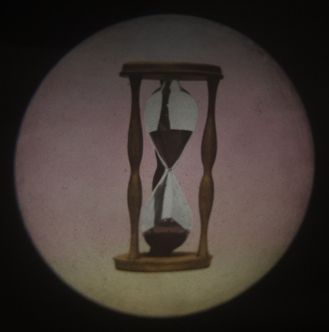 Lot 031 - Antique Hand Colored Odd Fellows I.O.O.F. Magic Lantern Glass Slide With Wood Holder, No. 15 The Hour Glass, Manufactured By The Henderson-Ames Co., Kalamazoo, Michigan