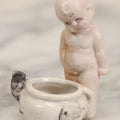 Lot 082 - Vintage Miniature Porcelain Baby Chamber Pot Figurine With Baby Looking Down At Potty And Mouse Crawling Out, Marked Made In Occupied Japan, 2-1/2" H