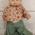 Lot 086 - Vintage Composition Head Googly Eye Baby Doll With Wooden Feet And Cloth Body, Wearing Patterned Shirt And Green Pants, 15-1/2" H