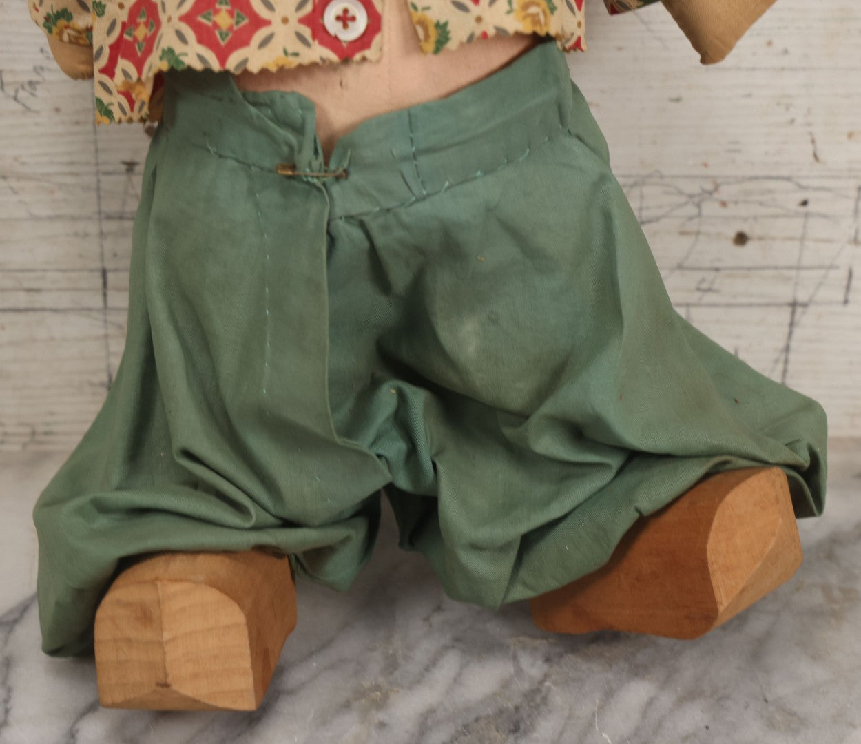 Lot 086 - Vintage Composition Head Googly Eye Baby Doll With Wooden Feet And Cloth Body, Wearing Patterned Shirt And Green Pants, 15-1/2" H