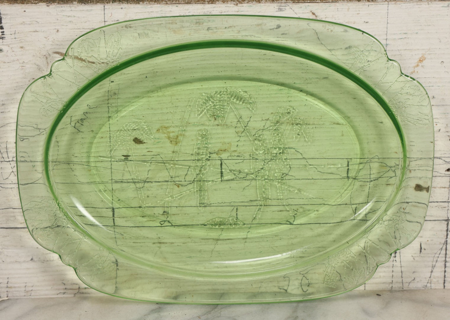 Lot 089 - Vintage Green Uranium Vaseline Glass Oval Dish By Federal Glass, Tropical Parrot And Palm Tree Motifs, Raised Underside Designs, Circa 1931, 11-1/2" x 8-1/4"
