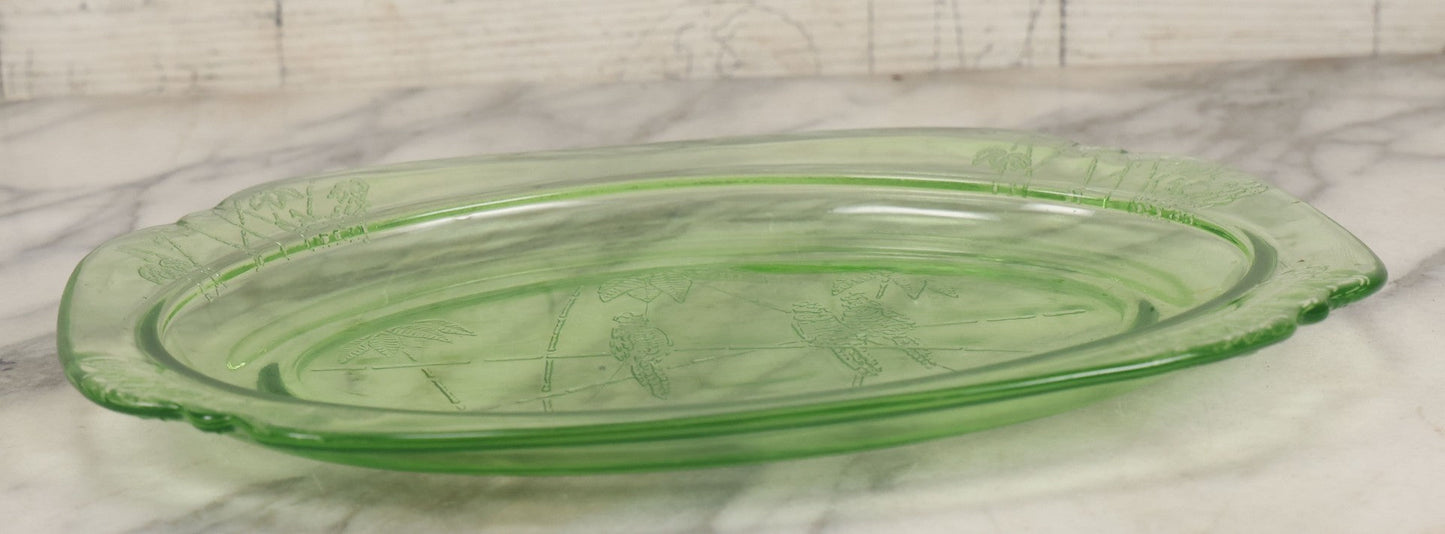 Lot 089 - Vintage Green Uranium Vaseline Glass Oval Dish By Federal Glass, Tropical Parrot And Palm Tree Motifs, Raised Underside Designs, Circa 1931, 11-1/2" x 8-1/4"