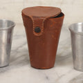 Lot 104 - Vintage Set Of Four Tin Travel Cups With Brown Leather Case