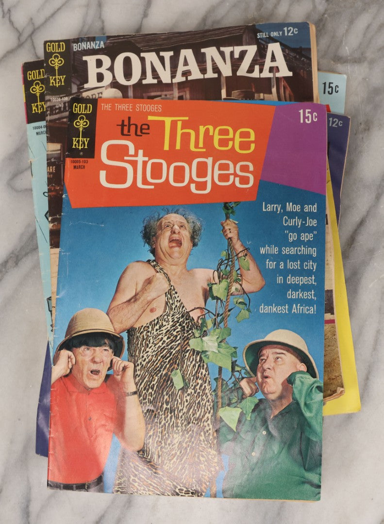 Lot 163 - Grouping Of Six Vintage Gold Key Comics, Including Daffy Duck, Heckle And Jeckle, Top Cat, Road Runner, The Three Stooges, And Bonanza