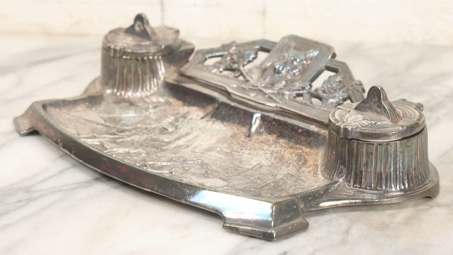 Lot 052 - Antique Cast Iron Double Inkwell With Chrome Finish Depicting Fox Head, Oak Branches, And English Hunting Scene With Hunter, Dog, And Stag, Stamped L.P., Circa Early 20th Century
