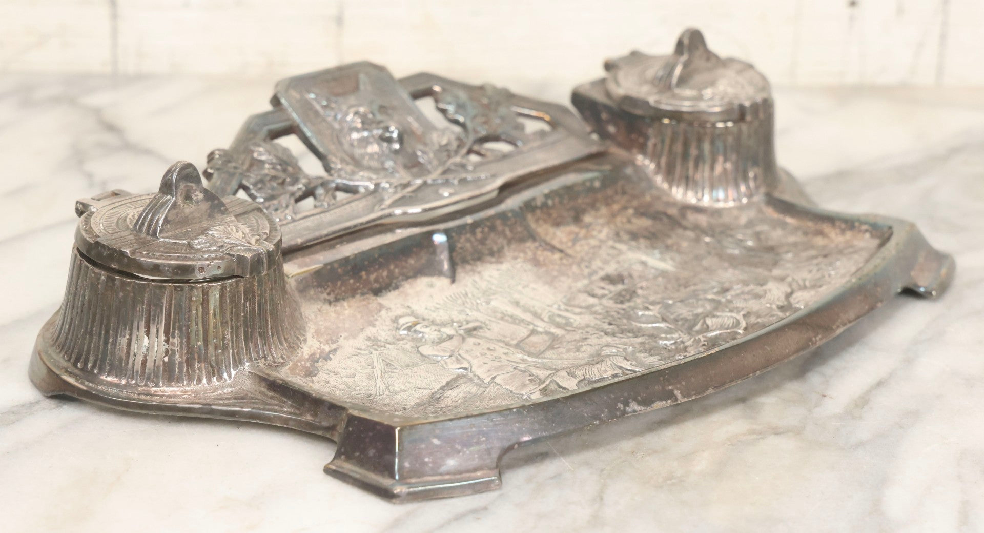 Lot 052 - Antique Cast Iron Double Inkwell With Chrome Finish Depicting Fox Head, Oak Branches, And English Hunting Scene With Hunter, Dog, And Stag, Stamped L.P., Circa Early 20th Century