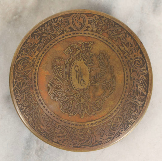 Lot 063 - Antique 1921 C. H. Hanson Co. Chicago Brass Advertising Paperweight With Ornate Crest And Motto "Handsome Is What Hanson Does," 3-3/8" Diameter