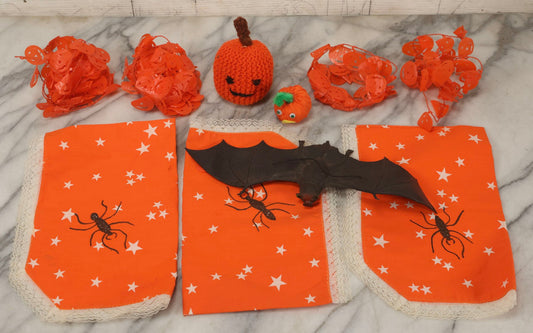 Lot 090 - Grouping Of Hallowe'en Toys And Crafts, Including Rubber Bat, Stuffed Knit Pumpkin, Three Painted Spider Placemats, Four Jack-O-Lantern Cellophane Garlands, And Google-Eyed Jack-O-Lantern Pin Cushion