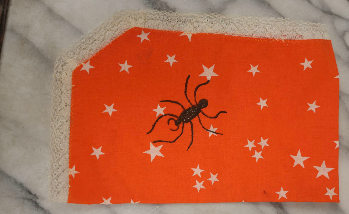 Lot 090 - Grouping Of Hallowe'en Toys And Crafts, Including Rubber Bat, Stuffed Knit Pumpkin, Three Painted Spider Placemats, Four Jack-O-Lantern Cellophane Garlands, And Google-Eyed Jack-O-Lantern Pin Cushion