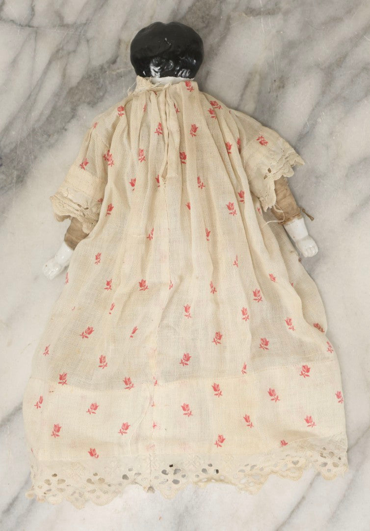 Lot 093 - Antique Doll With Porcelain Head, Hands And Feet And Cloth Body, With White Nightgown With Red Flower Print And Lace Borders, 12-1/4" H
