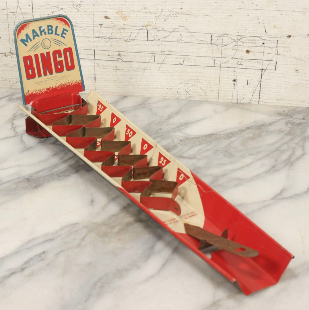 Lot 097 - Vintage Tin Lithograph "Marble Bingo" Toy With Folding Backboard And Spring Launcher, Made By Wolverine Supply Manufacturing Co., Pittsburgh, Pennsylvania, 16-1/2" L
