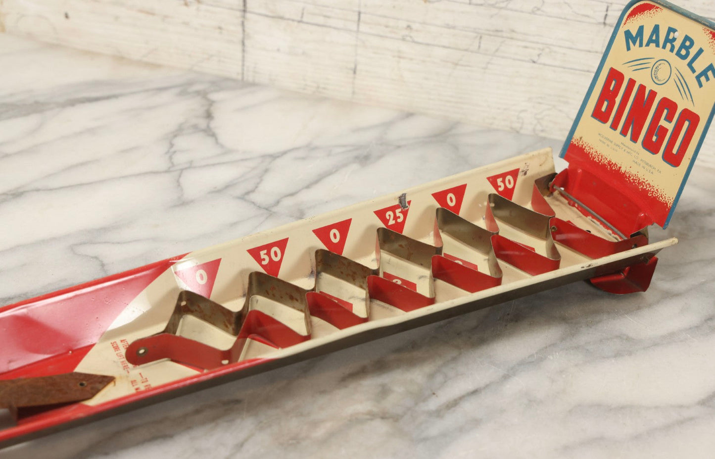 Lot 097 - Vintage Tin Lithograph "Marble Bingo" Toy With Folding Backboard And Spring Launcher, Made By Wolverine Supply Manufacturing Co., Pittsburgh, Pennsylvania, 16-1/2" L