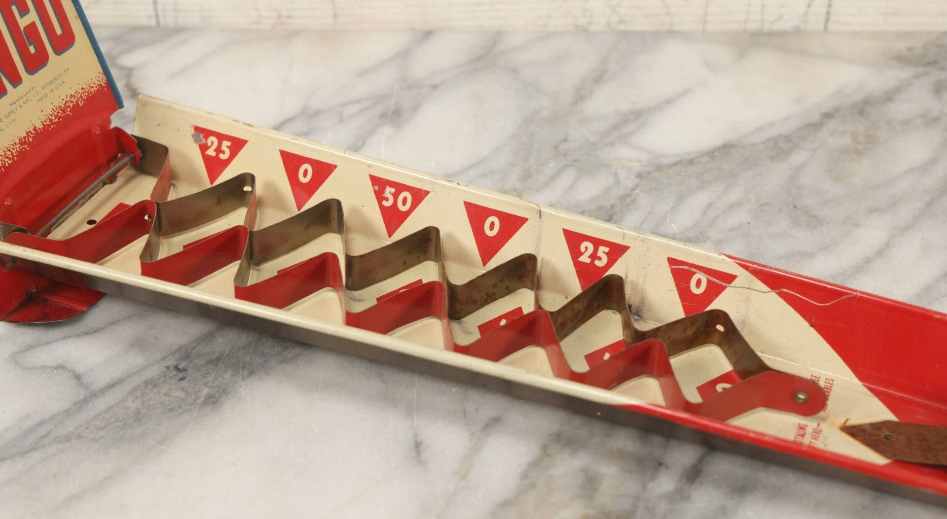 Lot 097 - Vintage Tin Lithograph "Marble Bingo" Toy With Folding Backboard And Spring Launcher, Made By Wolverine Supply Manufacturing Co., Pittsburgh, Pennsylvania, 16-1/2" L