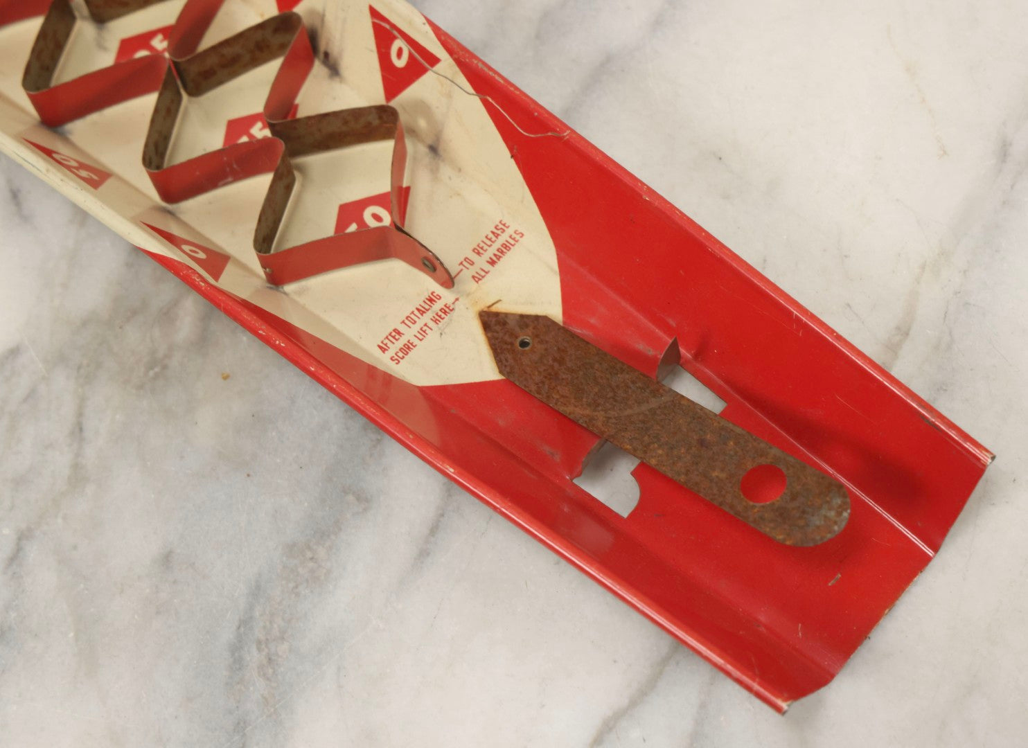 Lot 097 - Vintage Tin Lithograph "Marble Bingo" Toy With Folding Backboard And Spring Launcher, Made By Wolverine Supply Manufacturing Co., Pittsburgh, Pennsylvania, 16-1/2" L