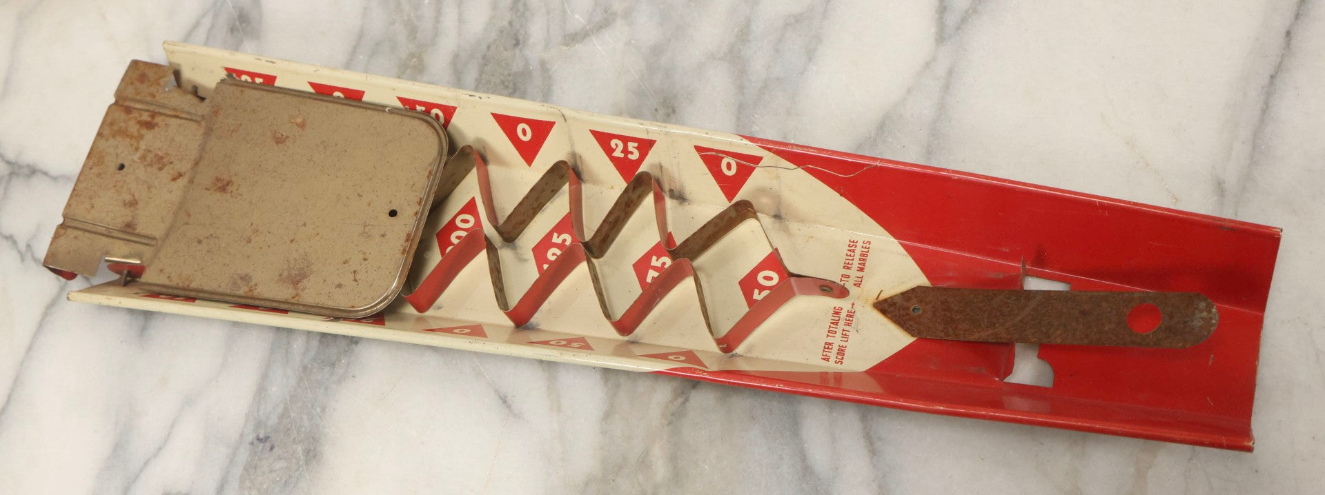 Lot 097 - Vintage Tin Lithograph "Marble Bingo" Toy With Folding Backboard And Spring Launcher, Made By Wolverine Supply Manufacturing Co., Pittsburgh, Pennsylvania, 16-1/2" L