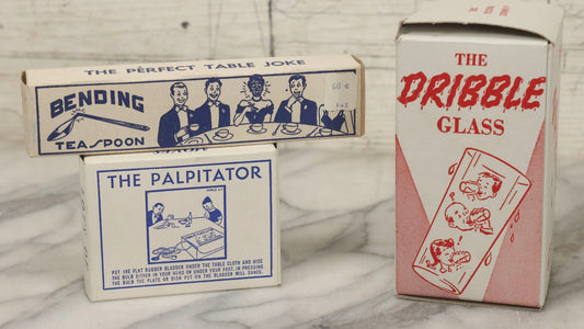 Lot 100 - Grouping Of Three Vintage Novelty Prank Tricks In Original Boxes Including Bending Teaspoon, "The Palpitator," And "The Dribble Glass"