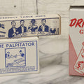 Lot 100 - Grouping Of Three Vintage Novelty Prank Tricks In Original Boxes Including Bending Teaspoon, "The Palpitator," And "The Dribble Glass"