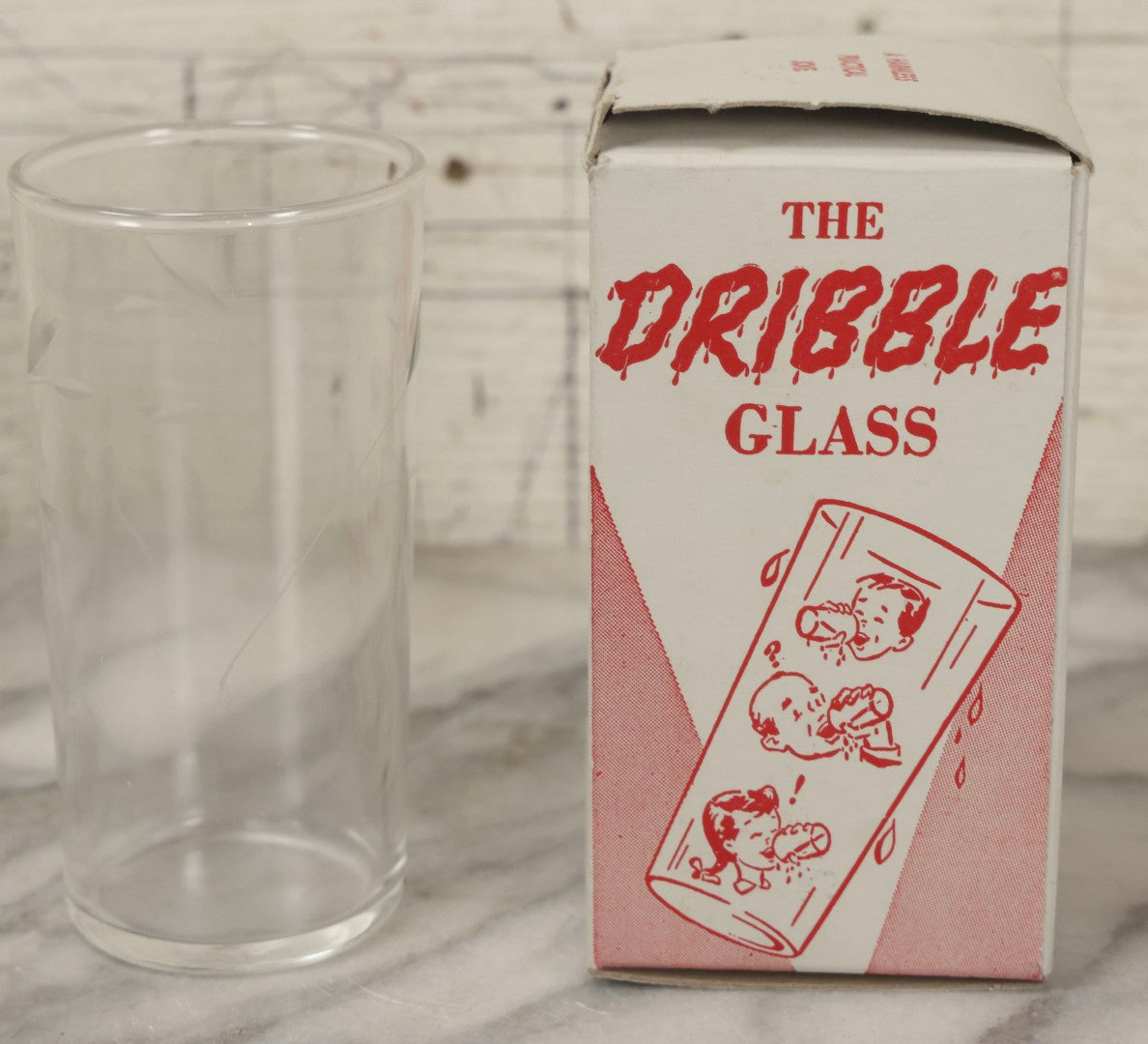 Lot 100 - Grouping Of Three Vintage Novelty Prank Tricks In Original Boxes Including Bending Teaspoon, "The Palpitator," And "The Dribble Glass"
