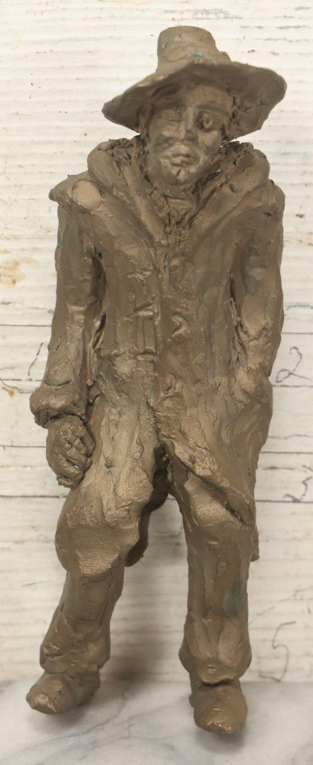 Lot 106 - Vintage Cast Metal Sculpture Of Man In Hat And Long Coat, Possibly Bronze, Heavy, Does Not Stand Independently, 7-1/2" H