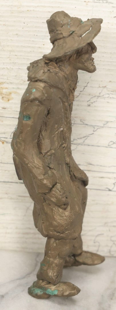 Lot 106 - Vintage Cast Metal Sculpture Of Man In Hat And Long Coat, Possibly Bronze, Heavy, Does Not Stand Independently, 7-1/2" H