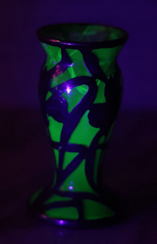 Lot 108 - Antique Green Uranium Glass Beaker-Form Bud Vase With .999 Fine Silver Overlay Floral Lily Design, Marked “Patent G 33.78” And “999 100 Fine” With Illegible Maker's Mark, Note Cracked and Damaged, 4-1/8" H