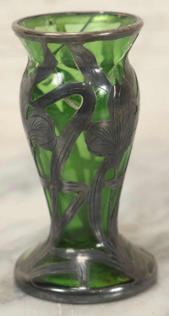 Lot 108 - Antique Green Uranium Glass Beaker-Form Bud Vase With .999 Fine Silver Overlay Floral Lily Design, Marked “Patent G 33.78” And “999 100 Fine” With Illegible Maker's Mark, Note Cracked and Damaged, 4-1/8" H