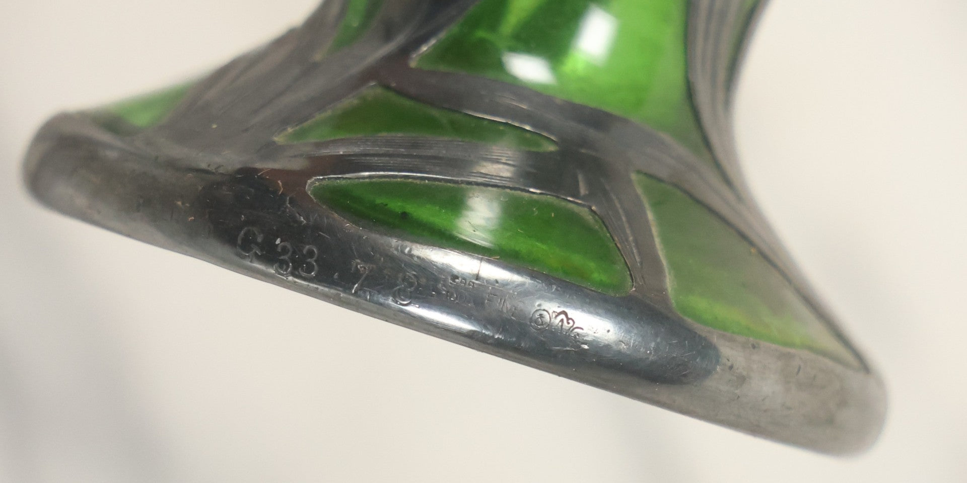 Lot 108 - Antique Green Uranium Glass Beaker-Form Bud Vase With .999 Fine Silver Overlay Floral Lily Design, Marked “Patent G 33.78” And “999 100 Fine” With Illegible Maker's Mark, Note Cracked and Damaged, 4-1/8" H