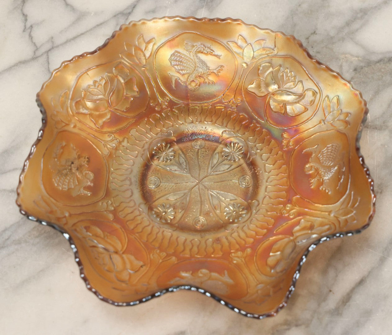 Lot 109 - Antique Peach-Colored Wish-Bone Style Carnival Glass Bowl With Dragon And Lotus Motifs, 8-3/4" Diameter
