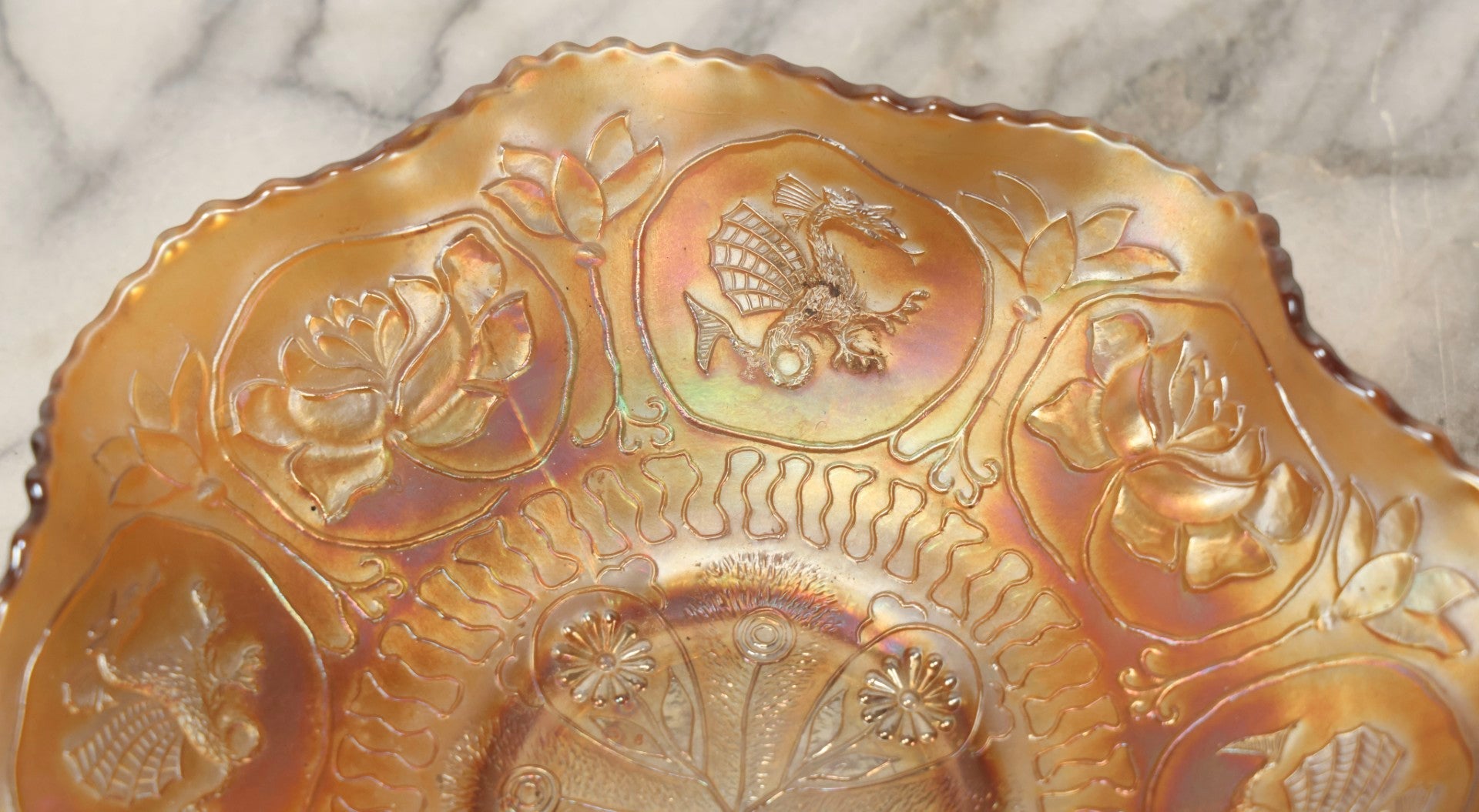Lot 109 - Antique Peach-Colored Wish-Bone Style Carnival Glass Bowl With Dragon And Lotus Motifs, 8-3/4" Diameter