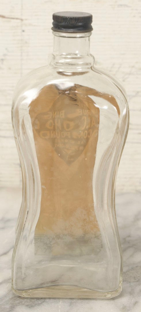 Lot 112 - Vintage W-R Rubbing Alcohol Compound Clear Glass Bottle With Paper Label And Original Cap, 70 Percent Alcohol, Manufactured By William Raymond Co., Philadelphia, Pennsylvania, 8-1/4" H