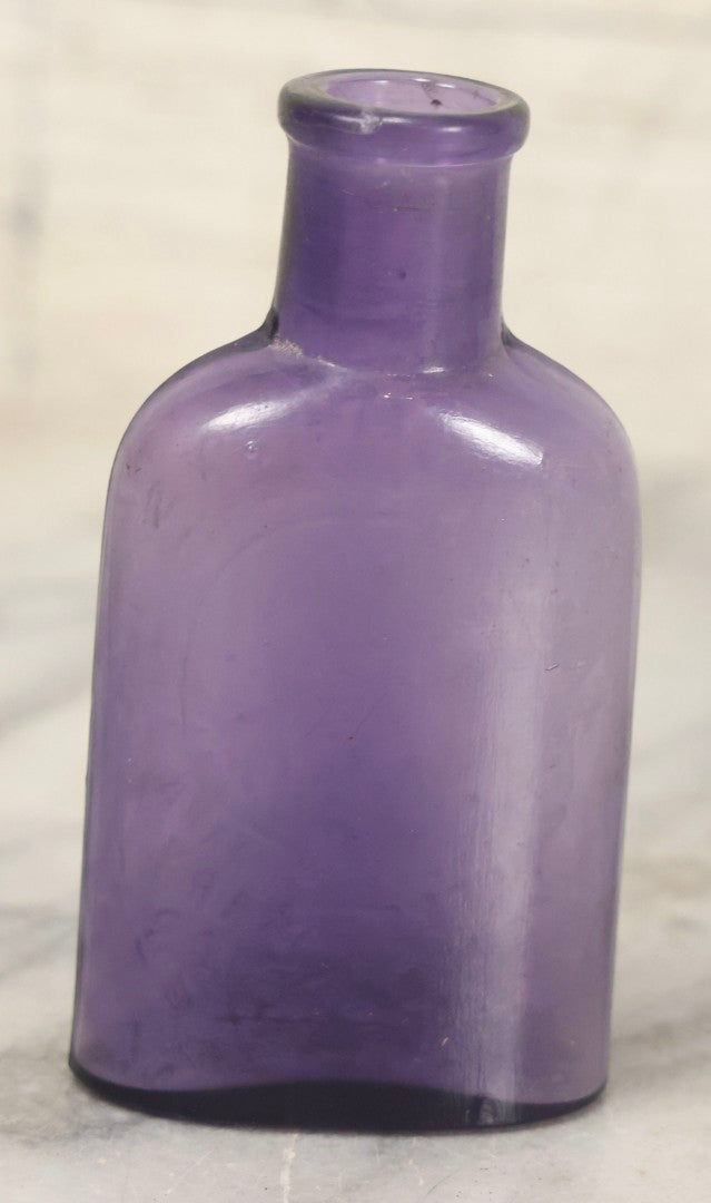 Lot 113 - Antique Embossed Purple Glass Bottle “Humphrey's Homeopathic Veterinary Specifics” With Horse Head Trademark, 3-1/2" H