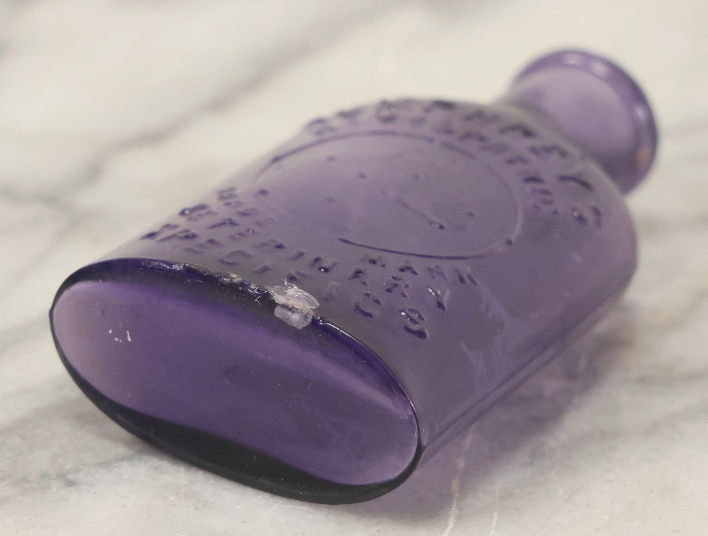 Lot 113 - Antique Embossed Purple Glass Bottle “Humphrey's Homeopathic Veterinary Specifics” With Horse Head Trademark, 3-1/2" H