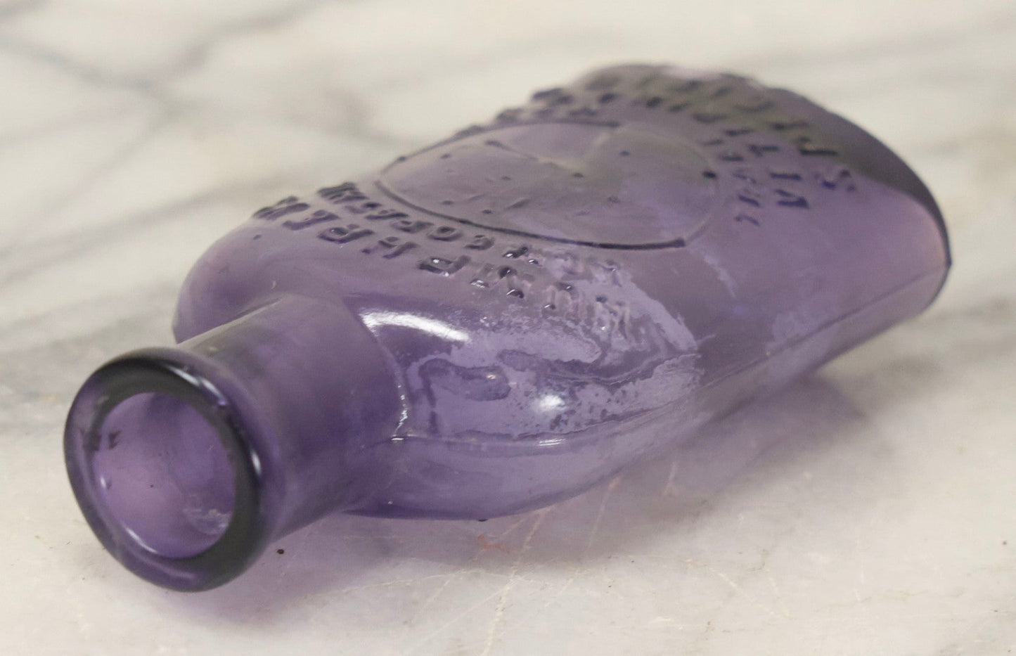 Lot 113 - Antique Embossed Purple Glass Bottle “Humphrey's Homeopathic Veterinary Specifics” With Horse Head Trademark, 3-1/2" H