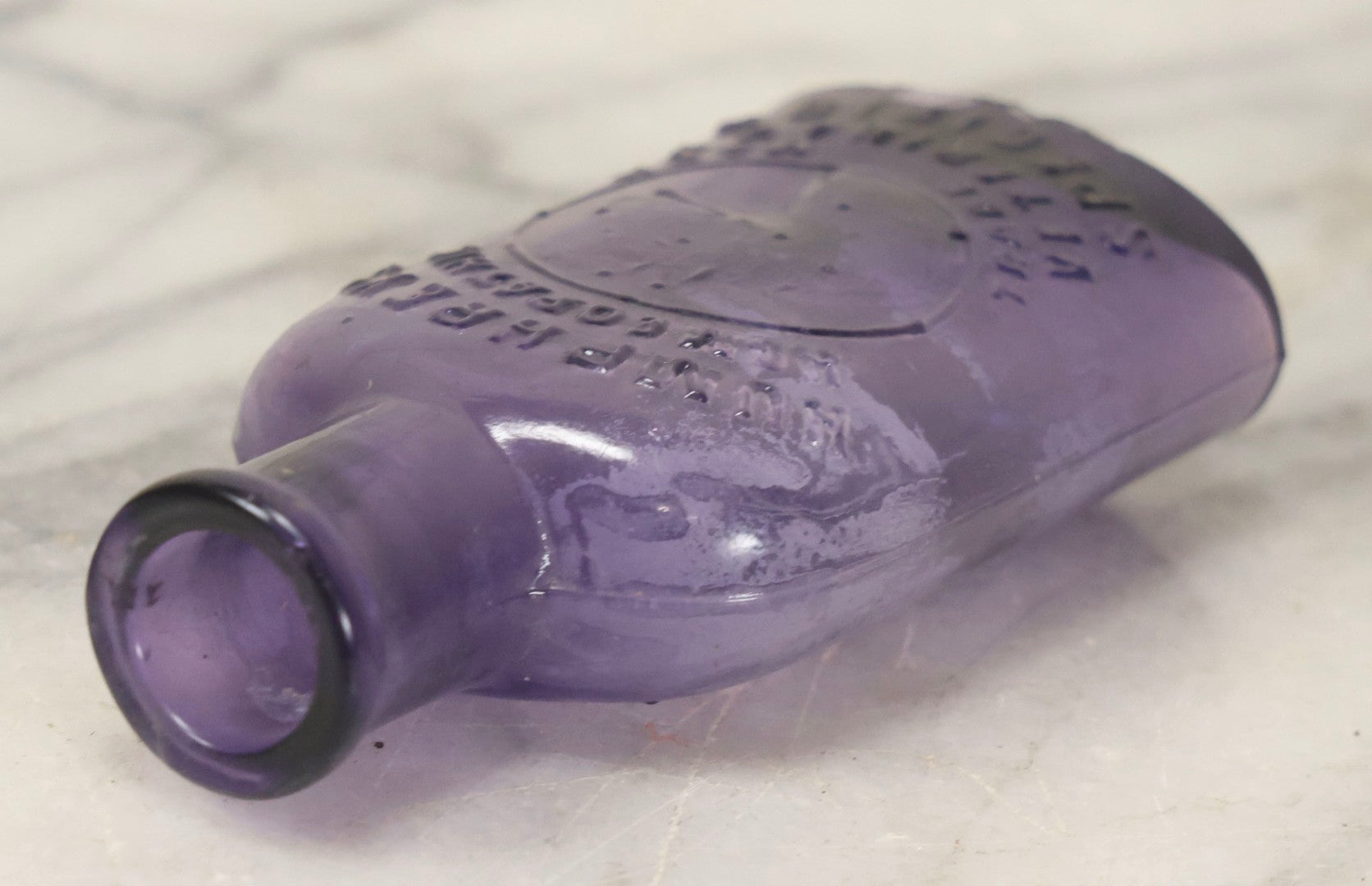Lot 113 - Antique Embossed Purple Glass Bottle “Humphrey's Homeopathic Veterinary Specifics” With Horse Head Trademark, 3-1/2" H