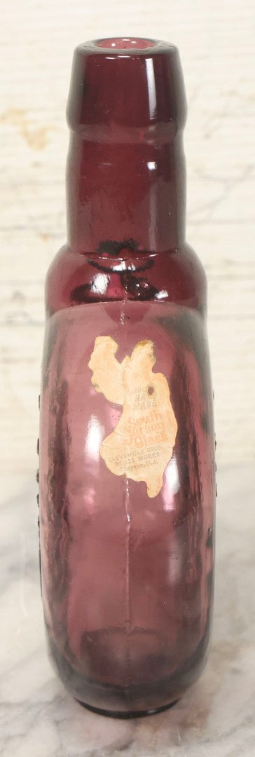 Lot 114 - Vintage Odd Fellows And Rebekah Commemorative Purple Glass Bottle, “New Jersey Eye Bank Visual Research Foundation,” 1973, With All-Seeing-Eye And F.L.T. Three Links, Clevenger Bros. Glass Works, Clayton, New Jersey, 7" H