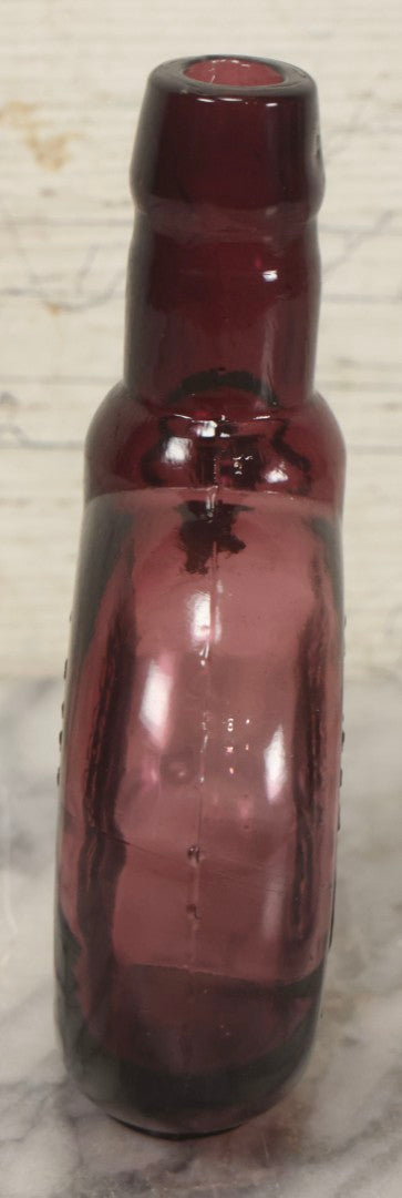 Lot 114 - Vintage Odd Fellows And Rebekah Commemorative Purple Glass Bottle, “New Jersey Eye Bank Visual Research Foundation,” 1973, With All-Seeing-Eye And F.L.T. Three Links, Clevenger Bros. Glass Works, Clayton, New Jersey, 7" H