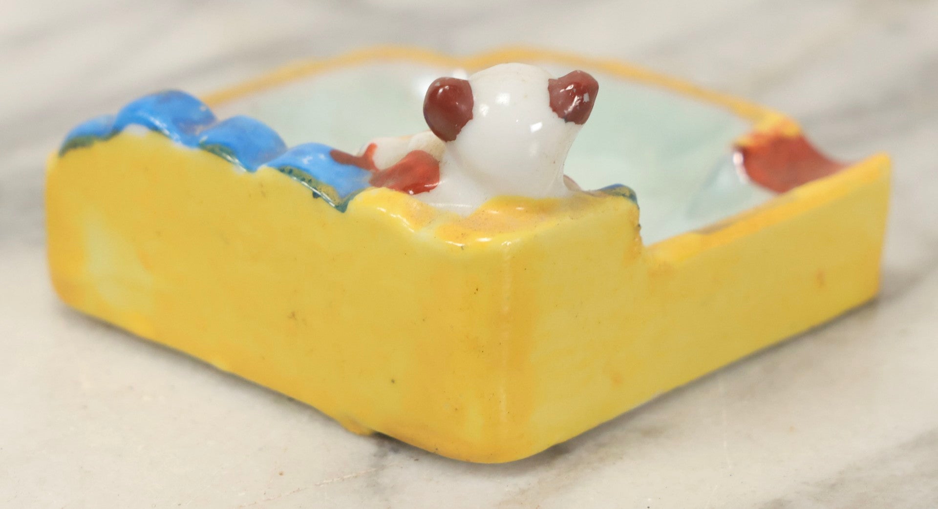Lot 118 - Vintage Porcelain Novelty Ashtray With Dog Playing Violin On Blue Sofa, Made In Japan, 2-3/4" Wide