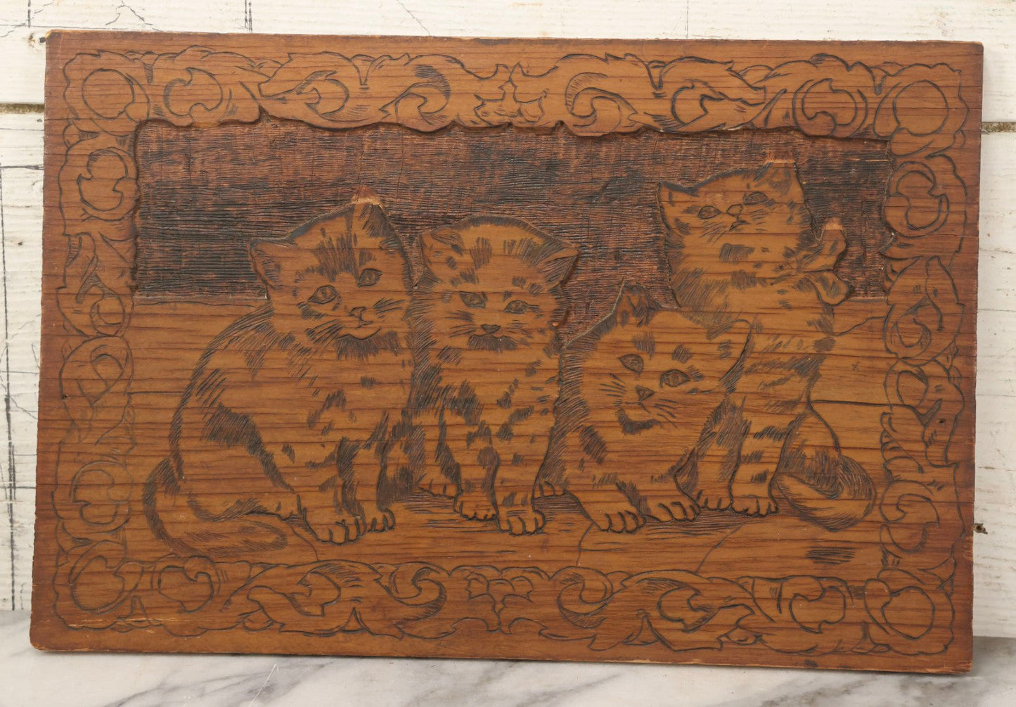Lot 119 - Antique Flemish Art Pyrography And Carved Plaque Depicting Four Kittens, 15" x 10"